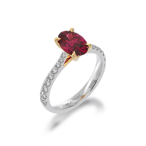 The Mondial by Nadia Oval cut Ruby on a diamond set band standing 45 degree view.