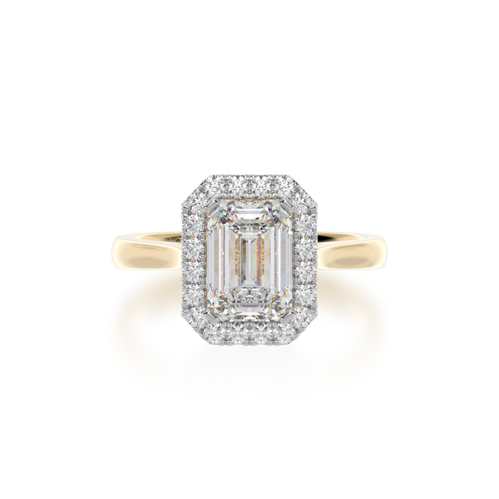 Emerald cut diamond halo engagement ring on yellow band view from top
