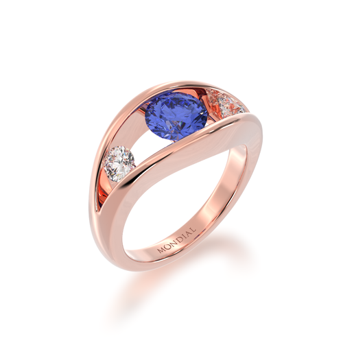 The Mondial by Nadia Flame design round brilliant cut blue sapphire engagement ring with diamonds in rose gold view from angle.