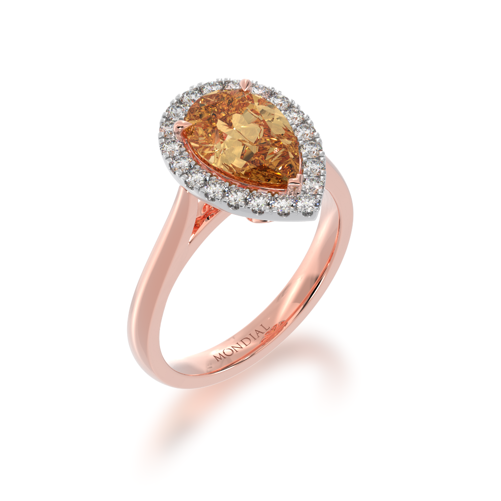 Pear shaped champagne diamond halo ring on rose gold band view from side