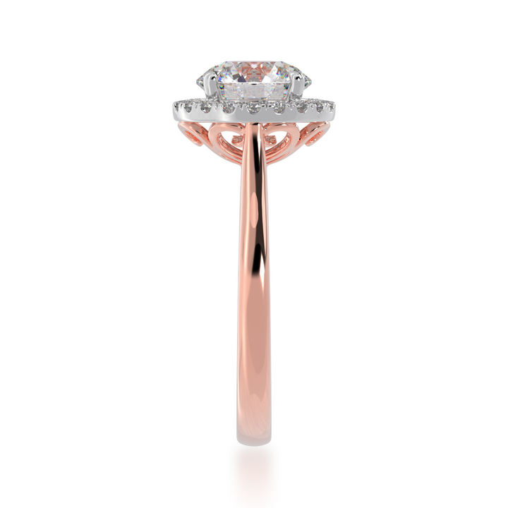 Round brilliant cut diamond halo on a rose gold band from side