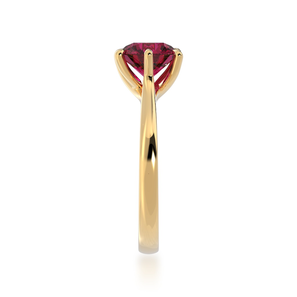 Brilliant cut ruby solitaire on a yellow gold band from side