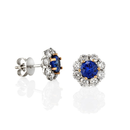 Pair of Diamond and Blue Sapphire stud earrings. Shown from side view to see the back stud clasp