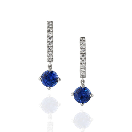 Pair of blue sapphire gemstone drop earrings with white diamonds along the earring hoop