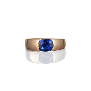 Yellow gold ring with a blue sapphire gemstone shown from the top of the ring view looking directly down on the sapphire