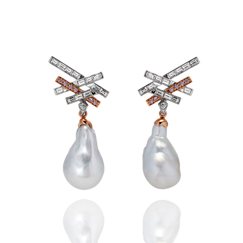 A set of earrings with emerald cut white diamonds and pink sapphires attached to a south sea pearl to create a drop earring