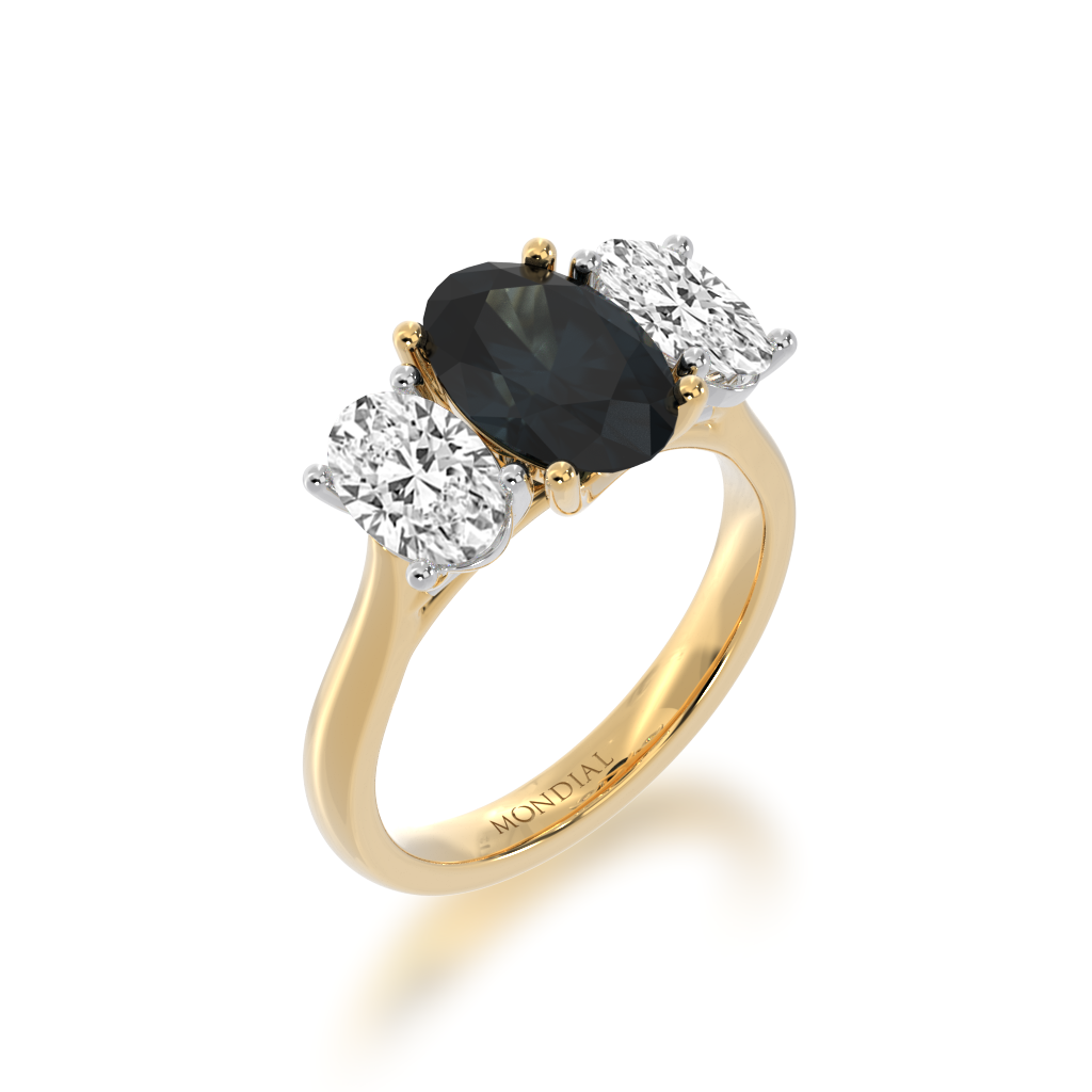 Trilogy oval cut black sapphire and diamond ring on yellow gold band view from angle 