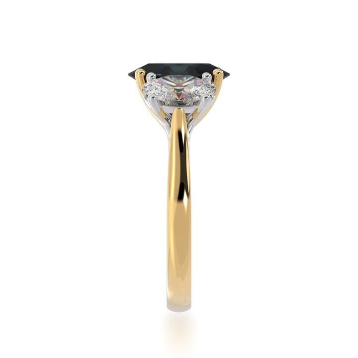 Trilogy oval cut black sapphire and diamond ring on yellow gold band view from side 