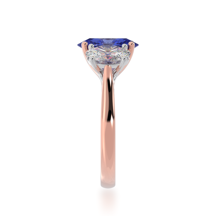 Trilogy oval cut blue sapphire and diamond ring on rose gold band view from side 