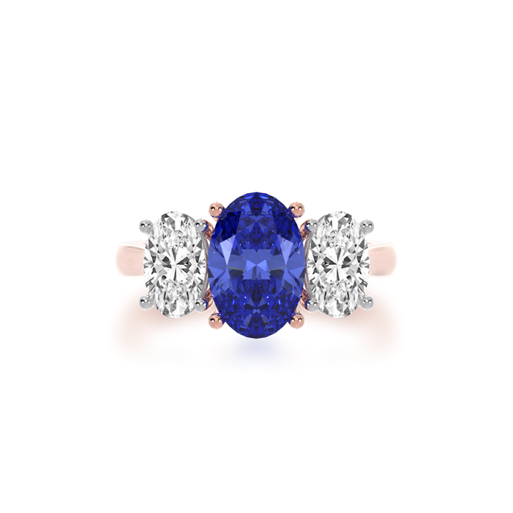 Trilogy oval cut blue sapphire and diamond ring on rose gold band view from top