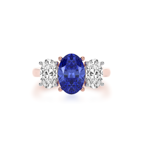 The Mondial by Nadia Trilogy oval cut blue sapphire engagement ring with diamonds on rose gold band view from top.