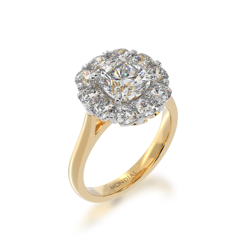 Cushion cut diamond cluster design on yellow gold band view from angle
