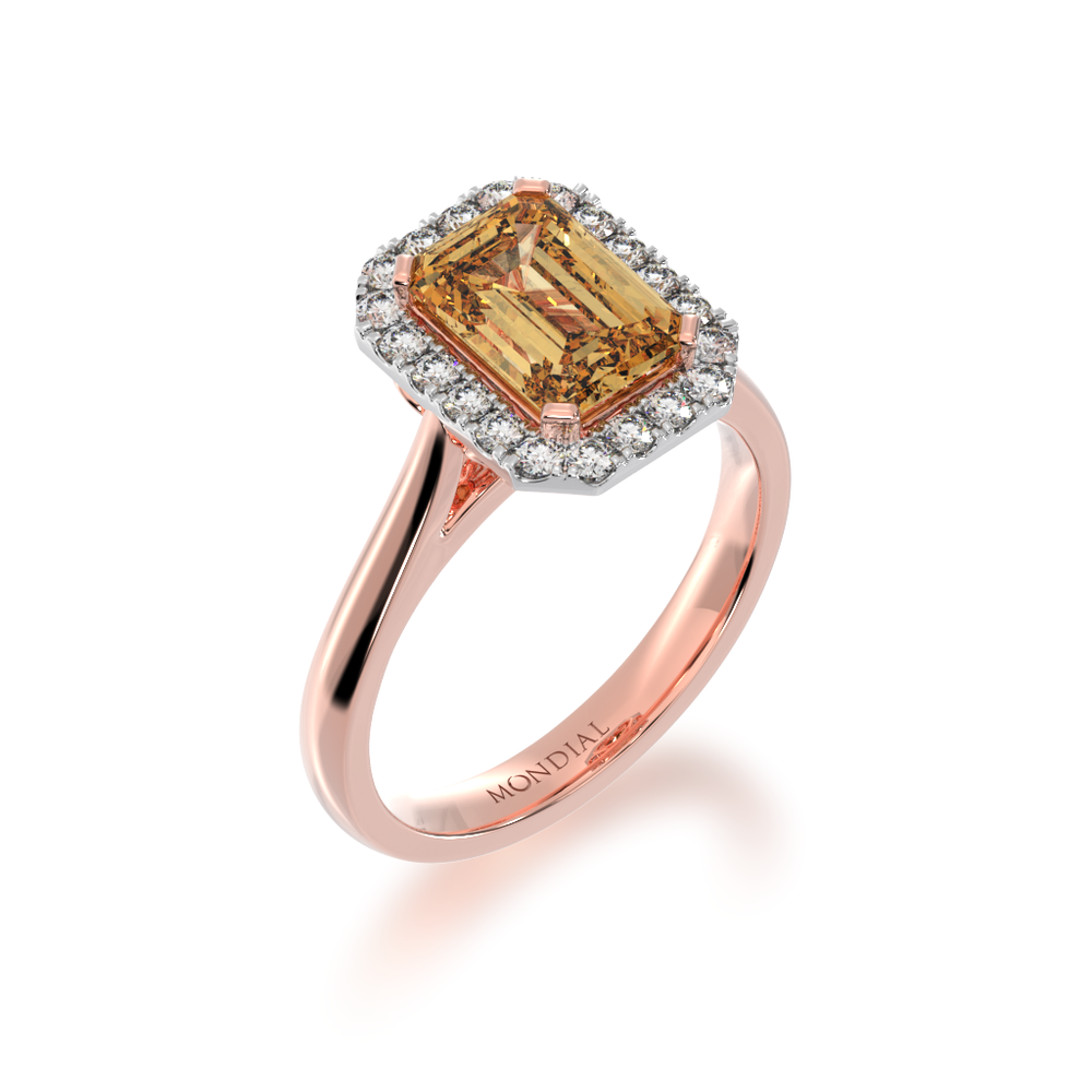 Emerald cut champagne diamond halo ring on rose gold band view from angle