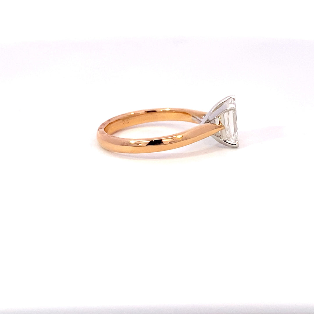 Emerald cut diamond solitaire ring on rose gold band