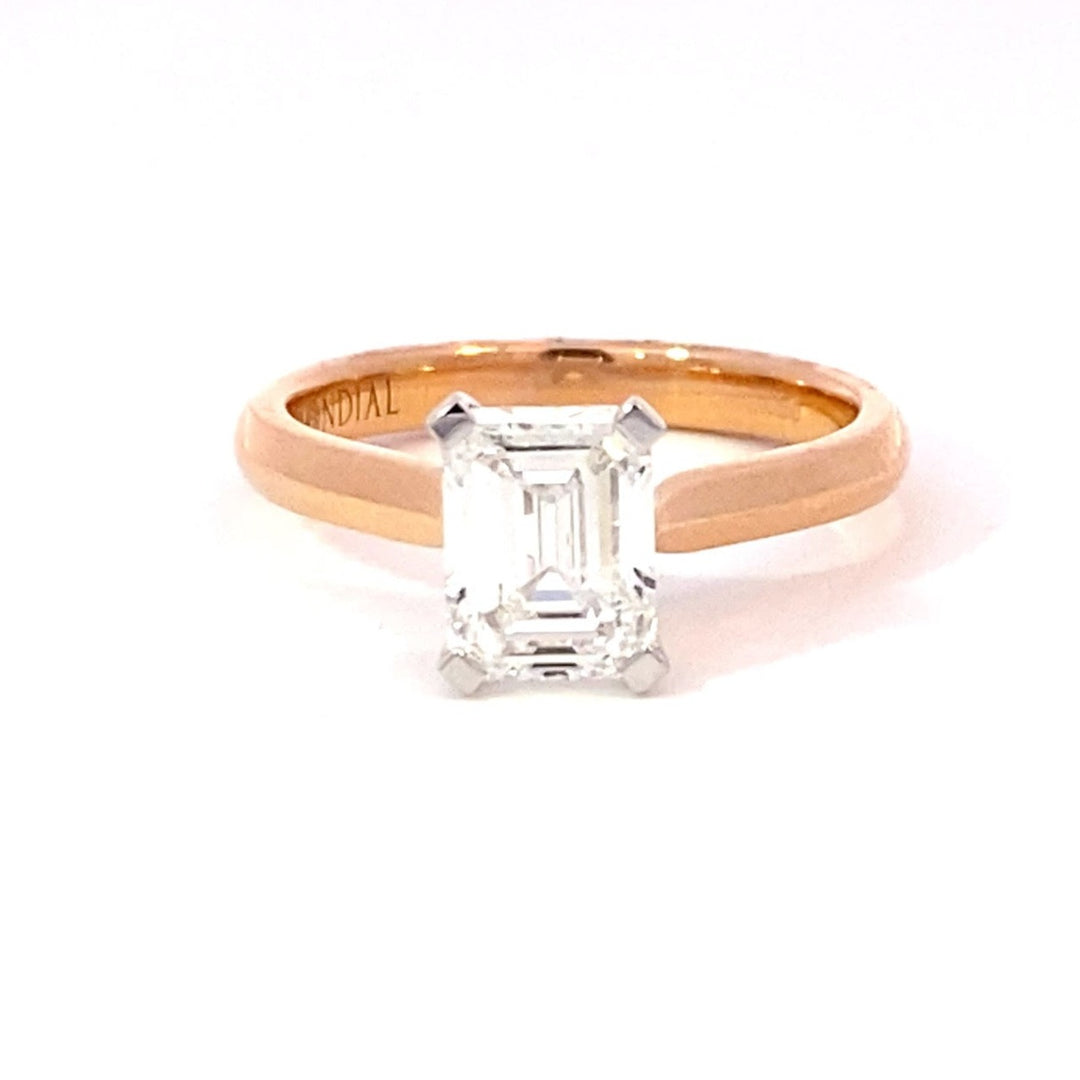 Emerald cut diamond solitaire ring on rose gold band