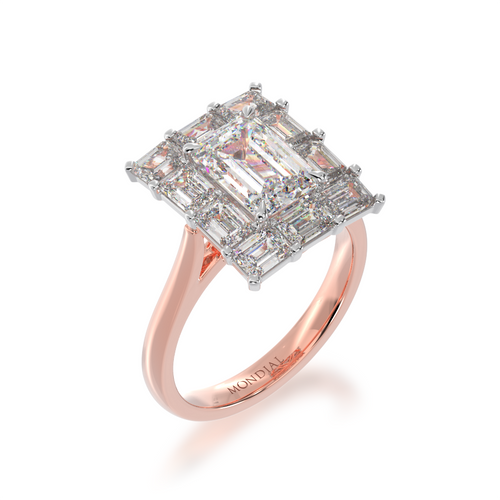 Emerald cut diamond cluster ring on rose gold band on standing 45 degree angle.