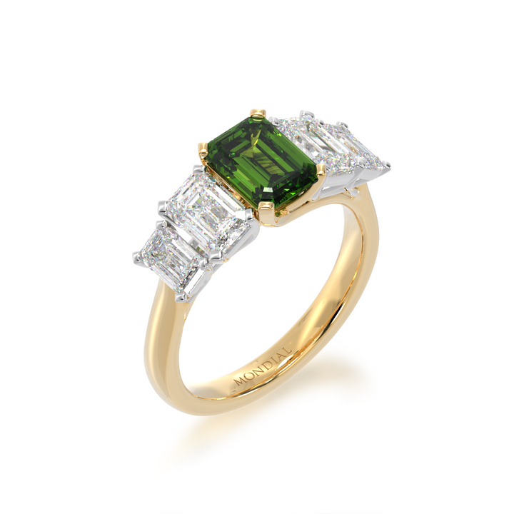 Five stone emerald cut green sapphire and diamond ring on a yellow band view from angle 