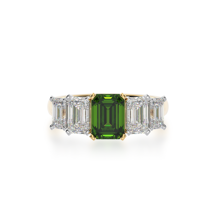 Five stone emerald cut green sapphire and diamond ring on a yellow band view from top 