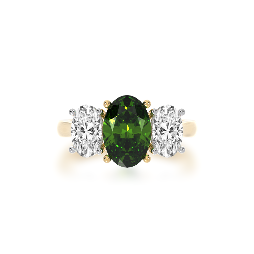 Trilogy oval cut green sapphire and diamond ring on a yellow gold band view from top