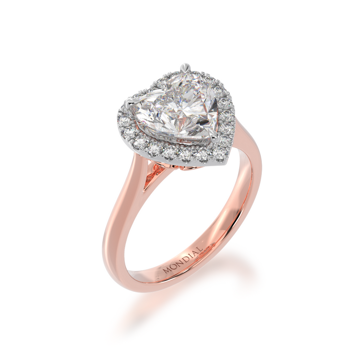 Heart shape diamond halo engagement ring on rose band