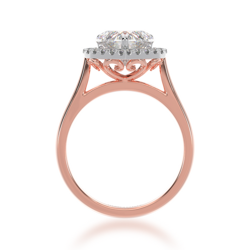 Heart shape diamond halo engagement ring on rose band