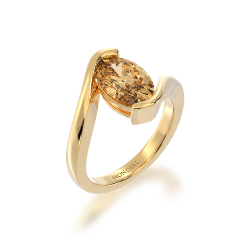 A side top view of the Mondial by Nadia oval diamond ring with Argyle diamond solitaire set in yellow gold Bordeaux design ring.