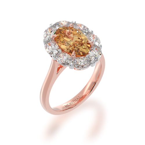 Oval diamond ring with champagne diamond cluster ring on rose gold band view on angle.