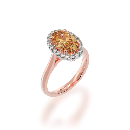 The Mondial by Nadia oval diamond ring with champagne diamond halo on rose gold band view from angle.