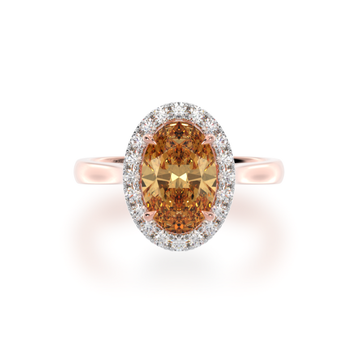 Oval cut champagne diamond halo engagement ring on rose gold band view from top