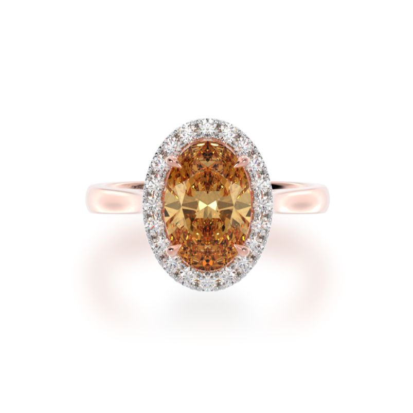 Oval cut champagne diamond halo engagement ring on rose gold band view from top