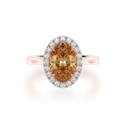 The Mondial by Nadia oval diamond ring with champagne diamond halo on rose gold band view from top.