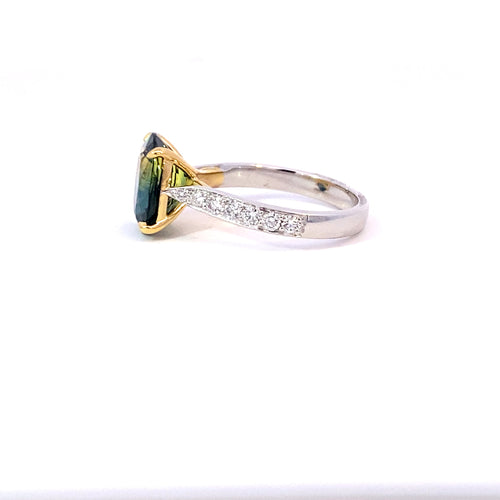 Oval cut green sapphire ring with diamond band