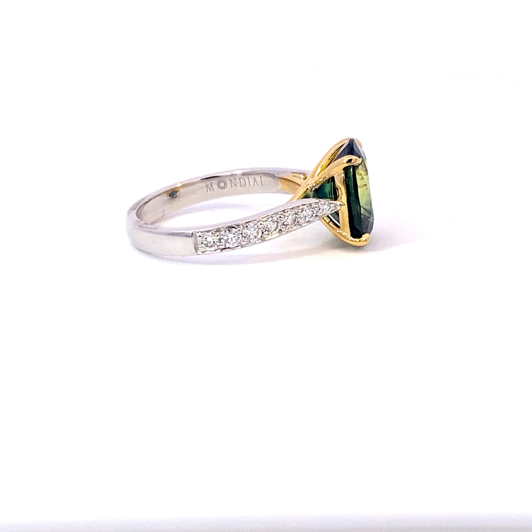 Oval cut green sapphire ring with diamond band