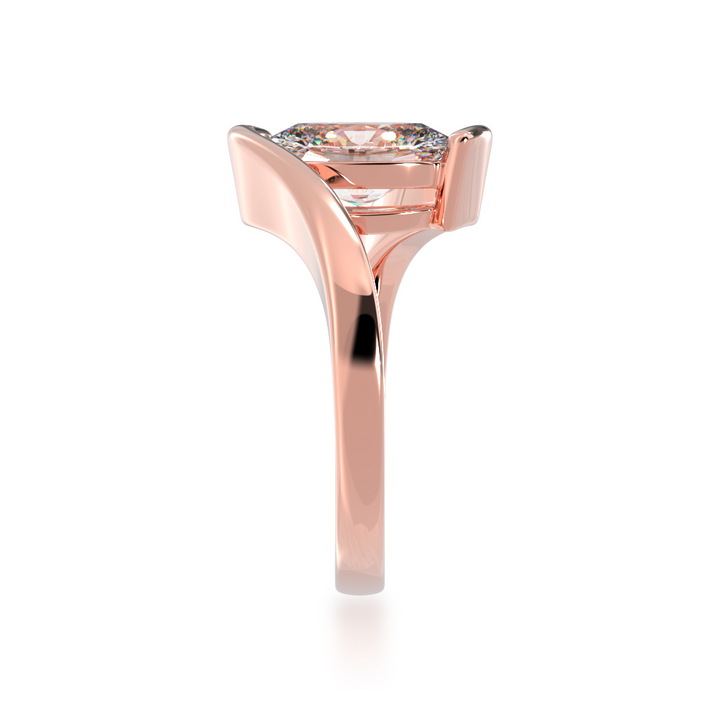 Oval cut diamond solitaire set in rose gold Bordeaux design ring