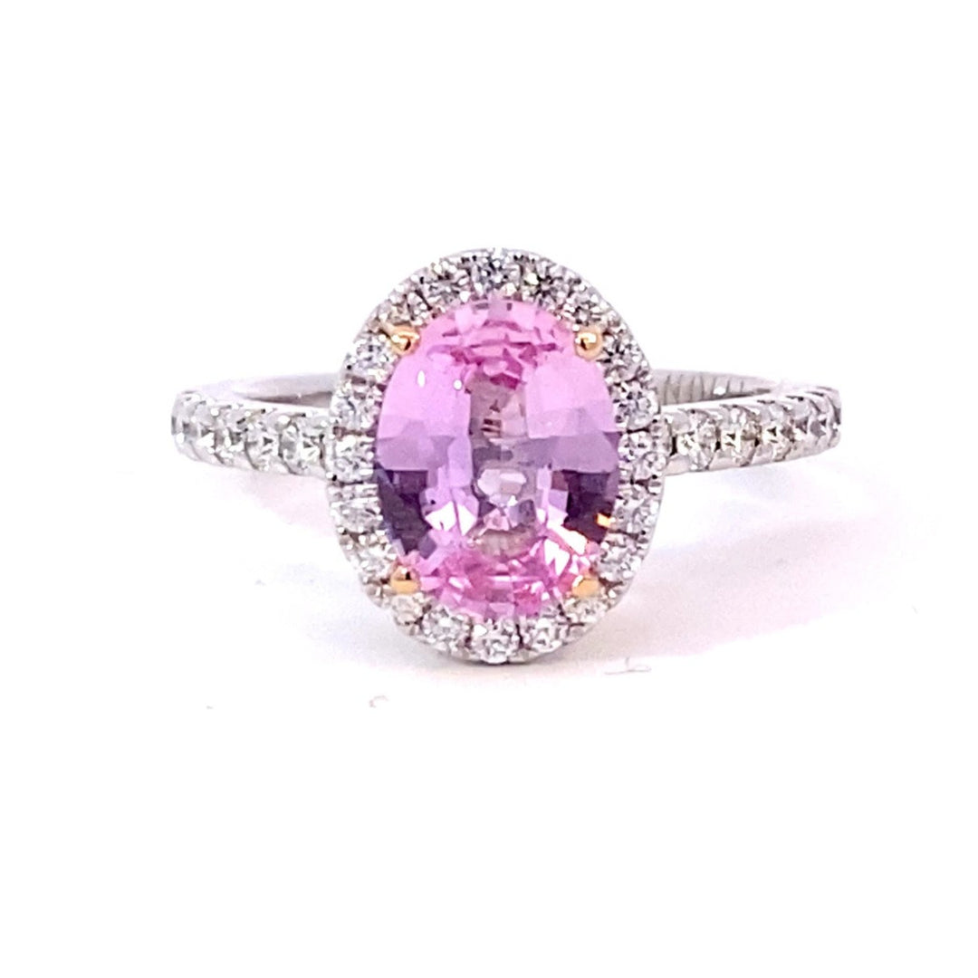 Oval cut pink sapphire diamond halo ring with diamond band