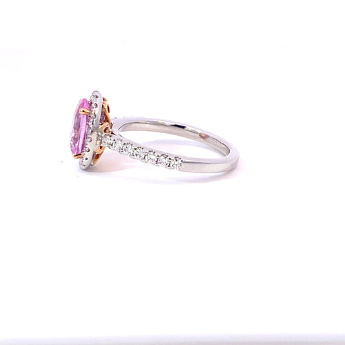 Oval cut pink sapphire diamond halo ring with diamond band