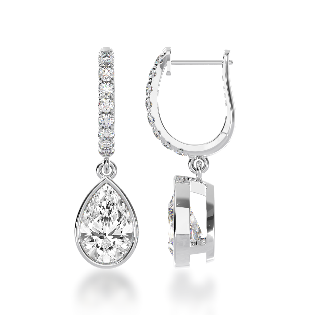 Pear shape bezel set diamond drop earrings on a diamond set huggie view from side 