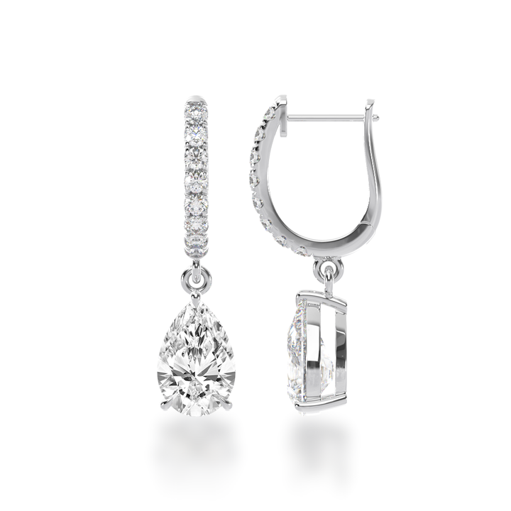 Pear shape diamond drop earrings on a diamond set huggie