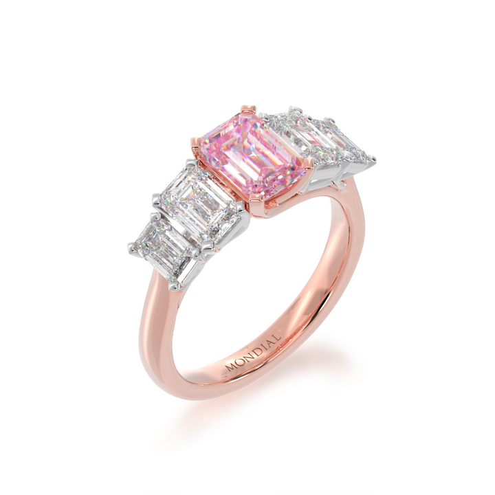 Five stone emerald cut pink sapphire and diamond ring from angle