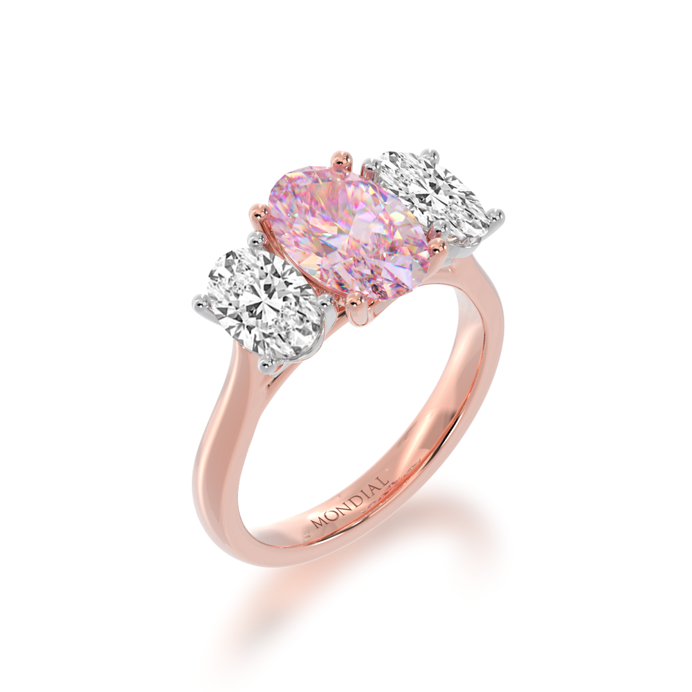 Trilogy oval cut pink sapphire and diamond ring on rose gold band view from angle 