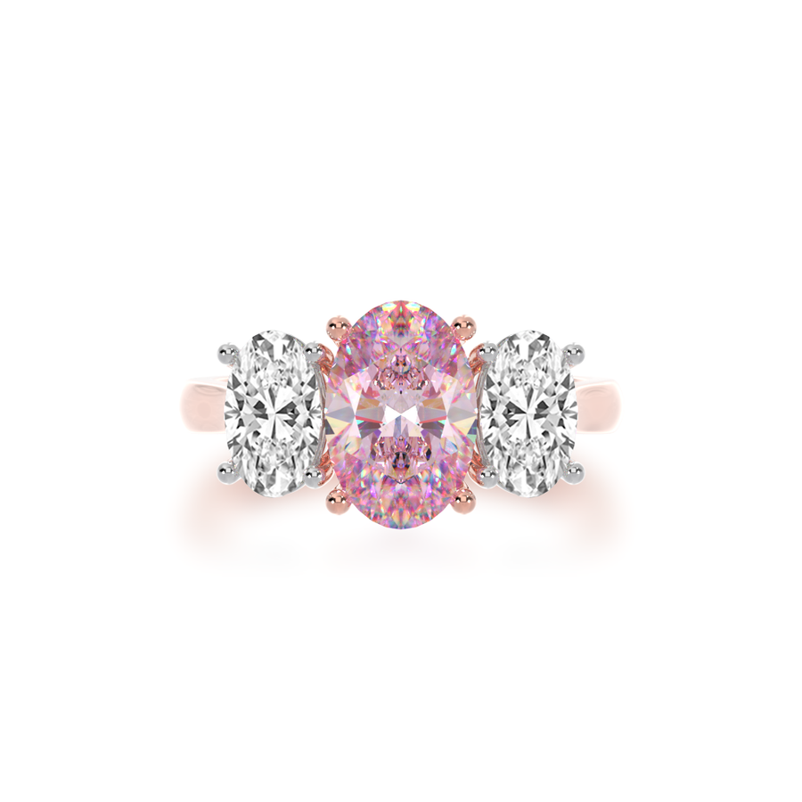 Trilogy oval cut pink sapphire and diamond ring on rose gold band view from top
