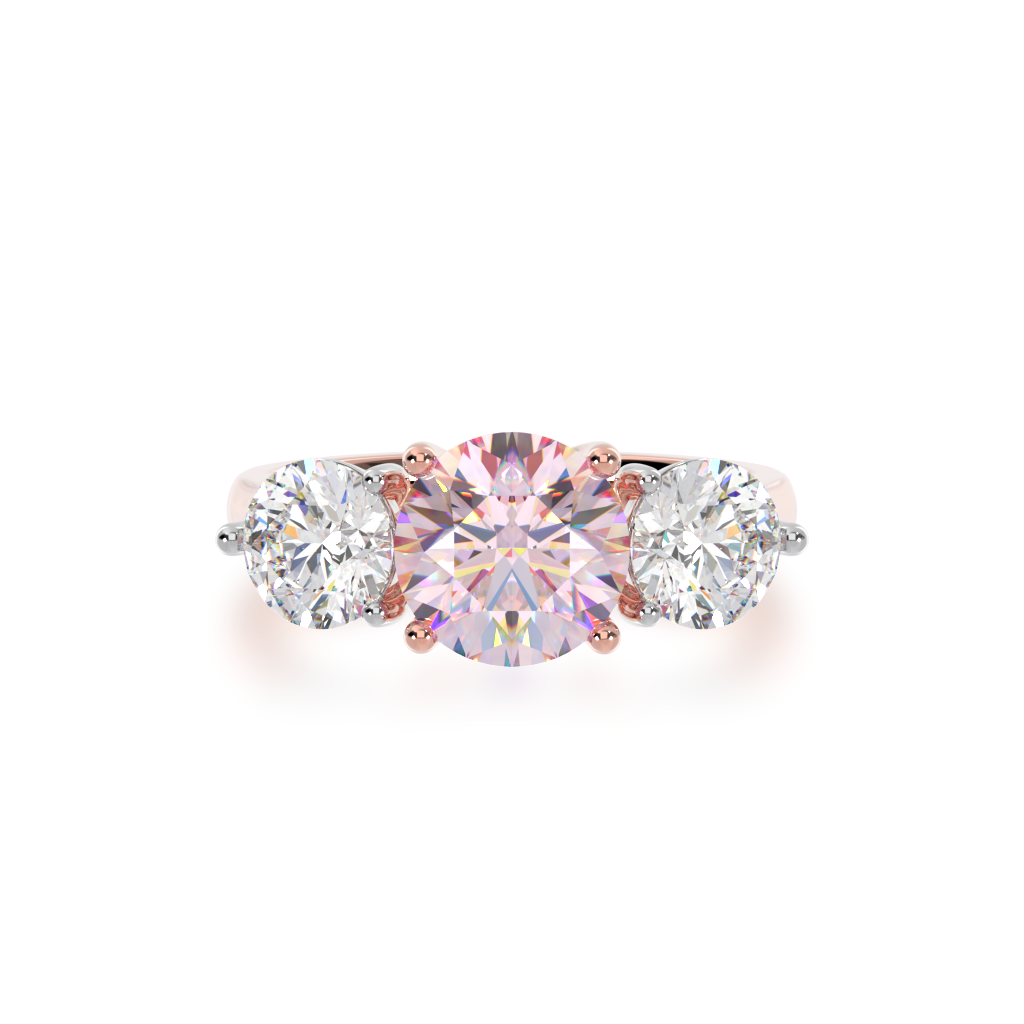 Trilogy round brilliant cut pink sapphire and diamond ring on rose gold band view from top