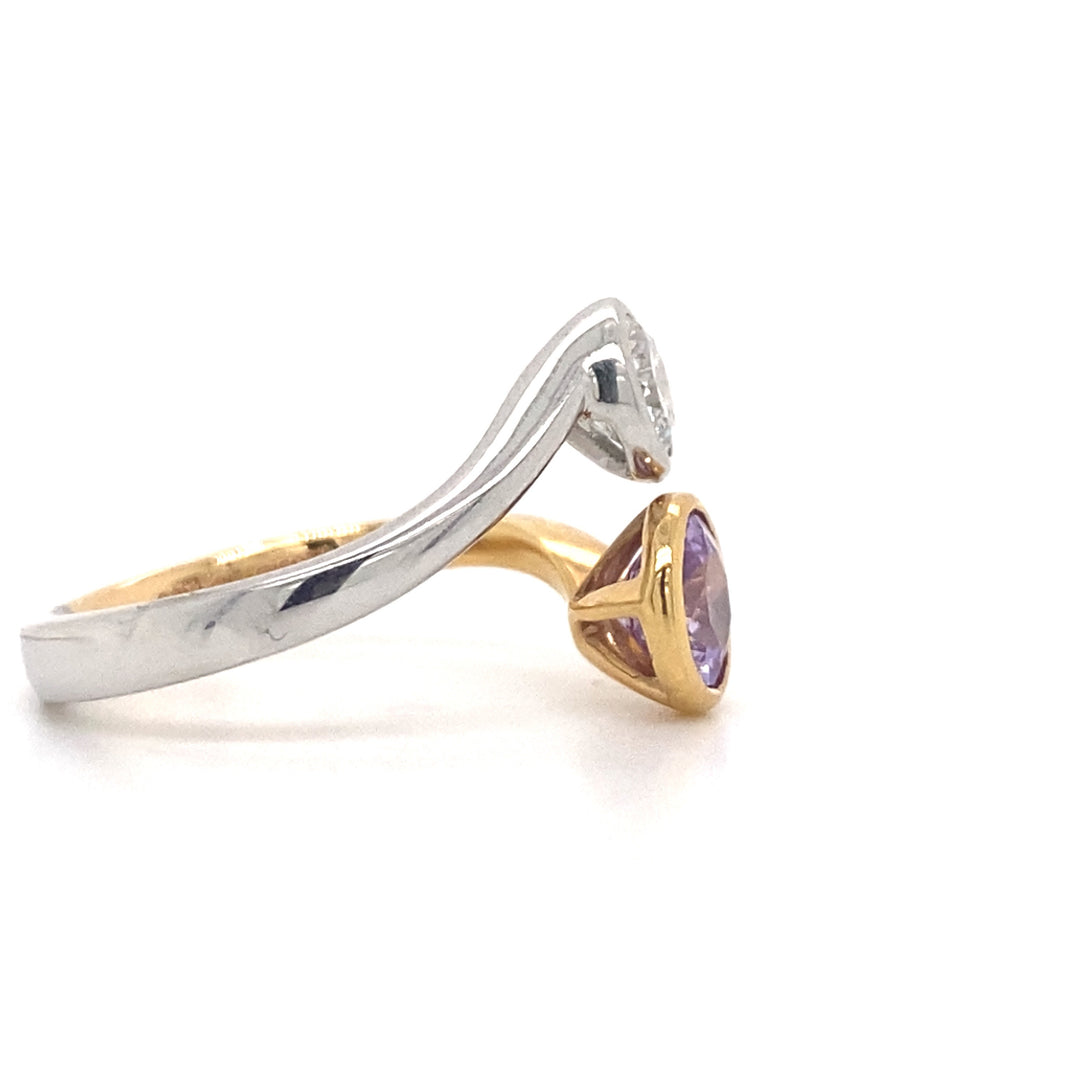 Round brilliant cut sapphire and diamond ring