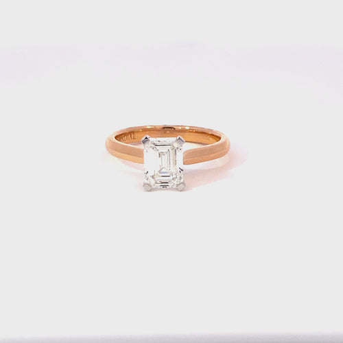 Emerald cut diamond solitaire ring on rose gold band