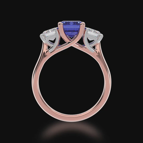 The Mondial by Nadia Trilogy emerald cut blue sapphire engagement ring with diamonds on rose gold band 3d view.