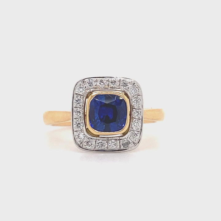 Cushion cut blue sapphire and diamond halo ring on rose gold band