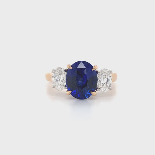 Trilogy oval cut blue sapphire and diamond ring on rose gold band