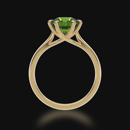 Brilliant cut green sapphire solitaire on a yellow gold band 3d video