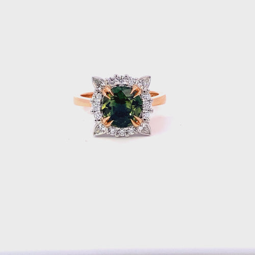 Round brilliant cut green sapphire diamond halo ring on rose gold band