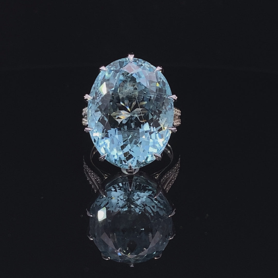 Aquamarine cocktail ring set with a cross hatched diamond basket video